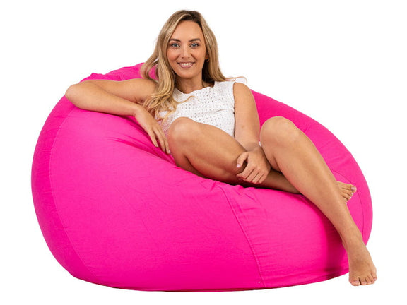 lady sitting on a hot pink bean bag chair